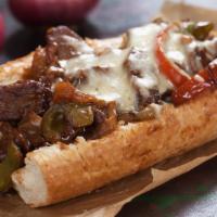 Loaded Philly Cheesesteak · Classic Philly cheesesteak loaded with juicy, chopped steak, your choice of melty cheese, gr...