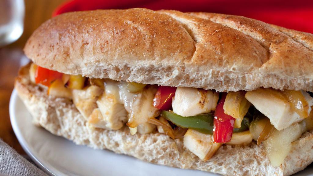 Chicken Philly Style Cheesesteak · Chicken Philly cheesesteak with tender, chopped, grilled chicken, your choice of melty cheese, grilled onions and peppers on a crusty French roll.