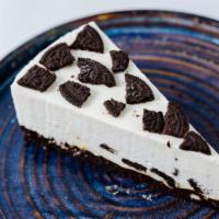 Oreo Cheesecake · Decadent, creamy, NY-style cheesecake marbled with crumbled bits of Oreo cookies.
