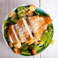 Caesar Salad with Grilled Chicken · Fresh green salad prepared with romaine lettuce, grilled chicken, parmesan cheese, and crout...