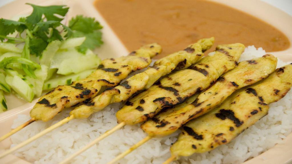 Sa-Tay Chicken · Grilled chicken breast marinated in Thai spices, served with peanut sauce and cucumber salad. Includes steamed white jasmine rice.