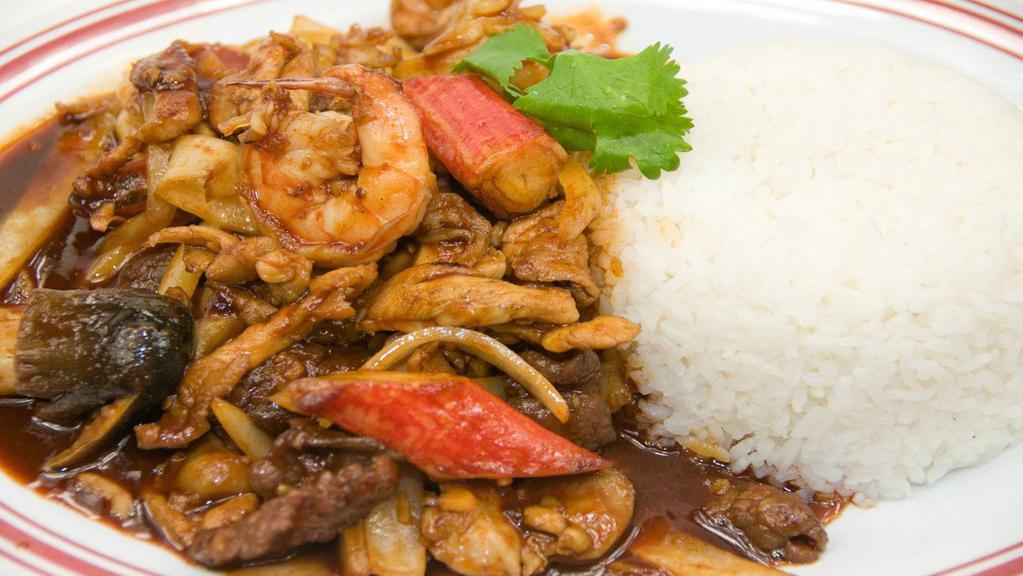 Combo Garlic Pepper · Sauteed chicken, beef, pork, imitaion crab, and prawns with mushrooms and onion in sweet garlic pepper sauce. Includes steamed white jasmine rice.