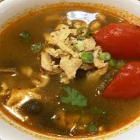 Tom Yum ( Chicken ) · An exotic blend of spicy, sweet, and sour flavors simmered with fresh lemon grass, mushrooms...