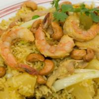 Pineapple Fried Rice · with prawns, chicken, egg, pineapple, onion, raisins, cashew nuts, peas and carrots.