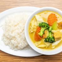 Yellow Curry Tofu · Tofu, potato, broccoli, cabbage, carrot, celery, onion, mushrooms, in coconut milk and yello...