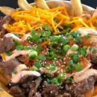 Loaded Korean Fries · Caramelized kimchi, grilled steak, cheddar cheese, samourai sauce, green onions and sesame s...