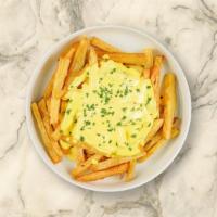 Cheese Fries · Golden potatoes deep-fried to perfection and topped with cheese.