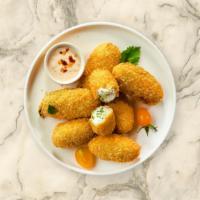 Jalapeno Poppers · Six piece golden deep-fried jalapeños filled with cream cheese.