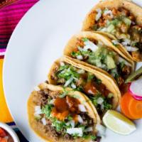 Four Street Tacos · Gluten free. Dairy free. Locally made corn tortillas with your choice of meat, diced onions,...