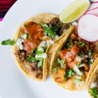 Three Street Tacos · Gluten free. Dairy free. Locally made corn tortillas with your choice of meat, diced onions,...