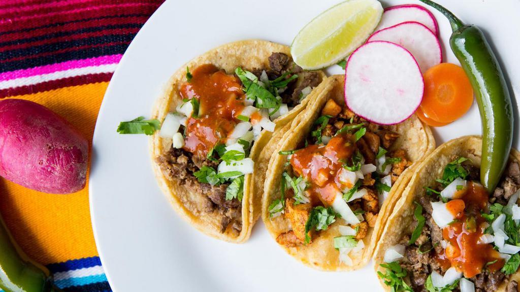 Three Street Tacos · Gluten free. Dairy free. Locally made corn tortillas with your choice of meat, diced onions, cilantro and hot or mild salsa.