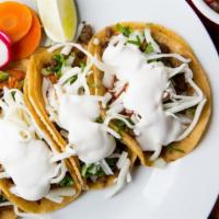 Four Super Street Tacos · Gluten free. Locally made corn tortillas with your choice of meat, diced onions, cilantro, c...