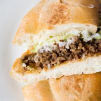 Tortas · Toasted Mexican telera bread with your choice of meat, onions, cilantro sour cream, lettuce ...