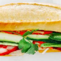 Bánh Mì The Cheesy Classic · Vietnamese homemade pork & chicken ham with melted American cheese.