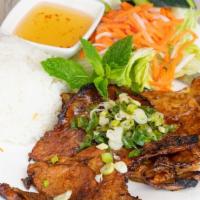 Grilled Pork Chops | Sường Nướng · Grilled pork chop with a choice of base, lettuce, cucumber, daikon, carrots, green onions.