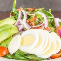 Popeye's Spinach Salad · Organic spinach, bacon, tomatoes, onions, avocado, and egg.