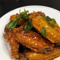 #8 Spicy Wings · Crispy wings sautéed with house special sauce.