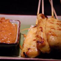 #4 Chicken Satay · Marinated chicken on skewers, served with peanut sauce and cucumber salad.