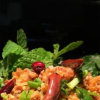 #12 Nam Kao (Crispy Rice Salad) · Crispy rice with ground pork, shredded coconut, cilantro, peanuts, green onions, mint and cr...