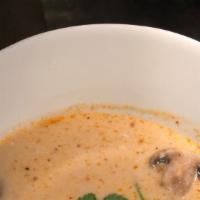 #15 Tom Kha · Spicy coconut milk soup with chicken or prawns lemongrass, galanga, mushroom, lemon juice an...
