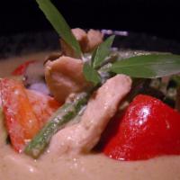 #44 Green Curry · Spicy green curry with chicken or beef or tofu or prawns eggplant, basil, red bell and cocon...