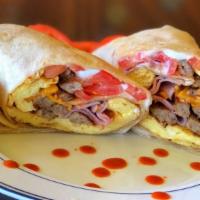Burrito with Meat · Egg, cheese, tomato, sour cream, and meat. Served with your choice of meat.