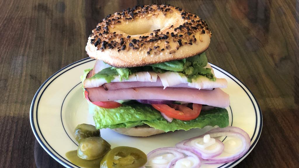 Turkey & Ham Sandwich · Mayonnaise, mustard, lettuce, tomato, onion, spinach, and swiss cheese. With Bagel, Bread, Baguette, English Muffin, or Croissant.