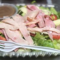 Chef's Salad · Lettuce, tomatoes, cucumber, cheese, ham, and turkey.