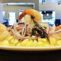 Ceviche Mixto · Fish, shrimp, mussels, scallop marinated with tiger´milk, served with sweet potatoes, Peruvi...