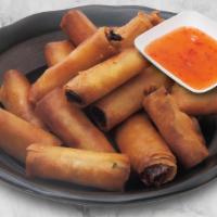 Y19. Fried Mini Egg Rolls炸春捲 · Egg Rolls with Chicken and Veggies, Served with Sweet and Sour Sauce.
