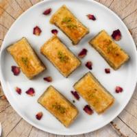 Pistachio Baklava  · Two pieces of famous Mediterranean flavored dessert with pistachios and nuts.