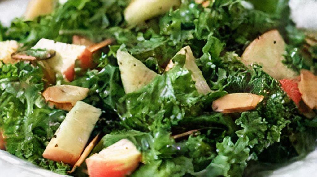 Kale Salad · Chopped kale, carrots, and marinated with olive oil and lemon juice.