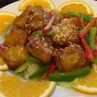 V15.Orange Chicken · Batter-fried vegetarian “chicken” cooked in sweet and sour orange sauce.