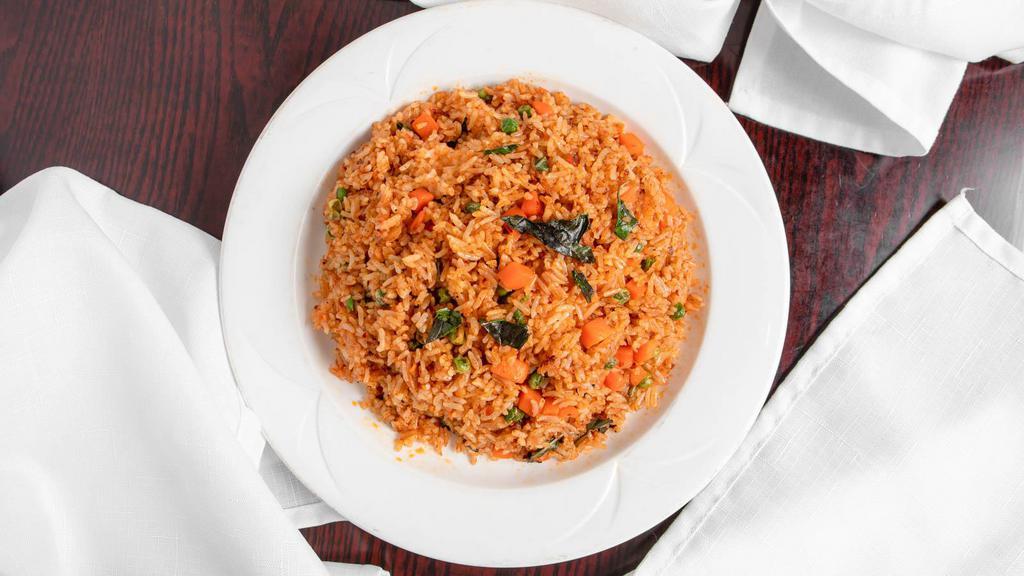 V8.Spicy Thai Fried Rice · Stir-fried rice with tofu, basil, carrots, peas, and spicy Thai seasonings.