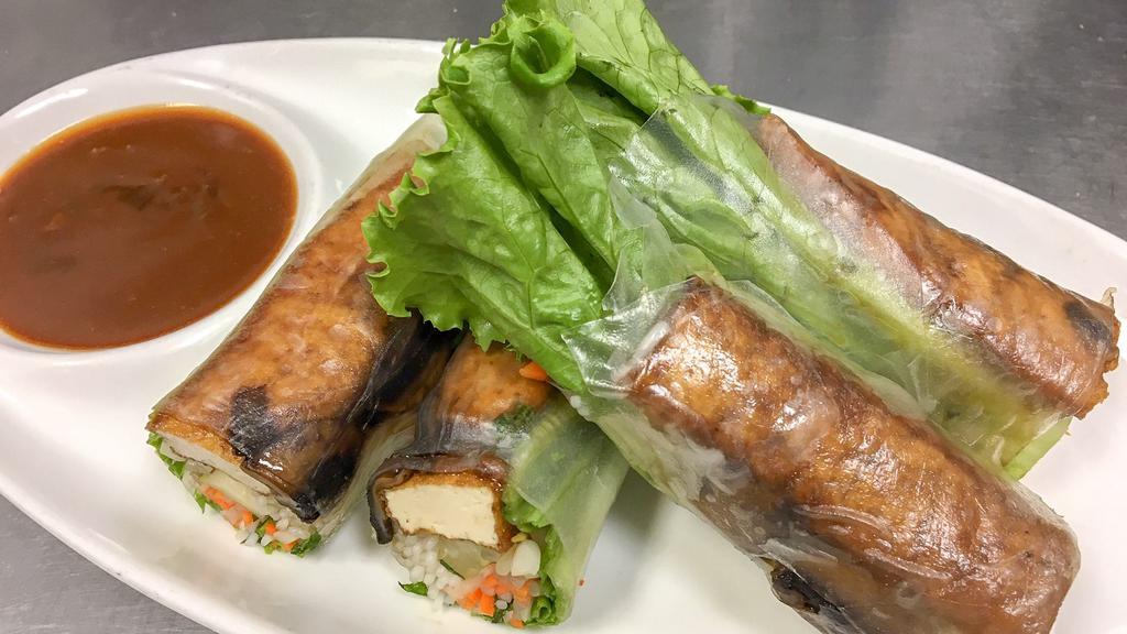 V3.Buddha Rolls (2) · Fresh rolls filled with sauteed tofu and mushroom, bean sprouts, lettuce, & mint wrapped in rice paper; served with peanut sauce.