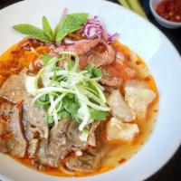 L5. Spicy Beef Noodle Soup (Bun Bo Hue) (L) · A spicy and rich soup base with plump rice vermicelli, blanched filet mignon, shank, and bri...