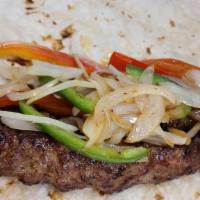 Shami Wrap · Two skewers of ground beef grilled with onions and bell peppers. Served with salad (lettuce ...