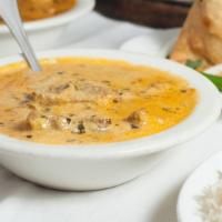 Lamb Korma · Boneless lamb cooked in mildly spiced creamy curry.