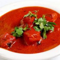 Shahi Paneer Tikka Masala · Lightly fried cheese cooked with nuts in creamy tomato sauce.