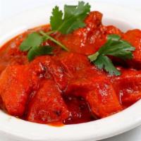 Chicken Vindaloo · Chicken cooked in hot spicy sauce with potatoes.
