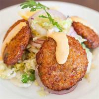 Crab Cakes · Crab meat, bread crumbs, bell pepper, and aioli.
