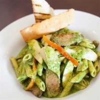 Rustica · Penne with fennel sausage, bell pepper, and artichoke heart in pesto sauce.