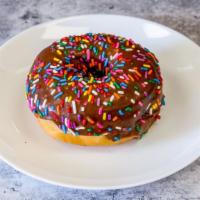 Chocolate with Sprinkles - Raised Donut · Sprinkles on top of our chocolate icing
