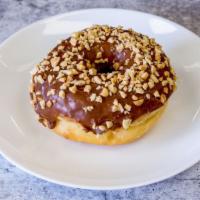 Chocolate with Peanuts - Raised Donut · Peanuts on top of chocolate icing