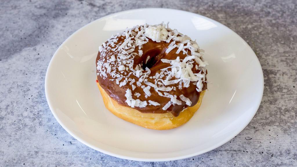 Chocolate with Coconut - Raised Donut · Coconut on top of chocolate icing