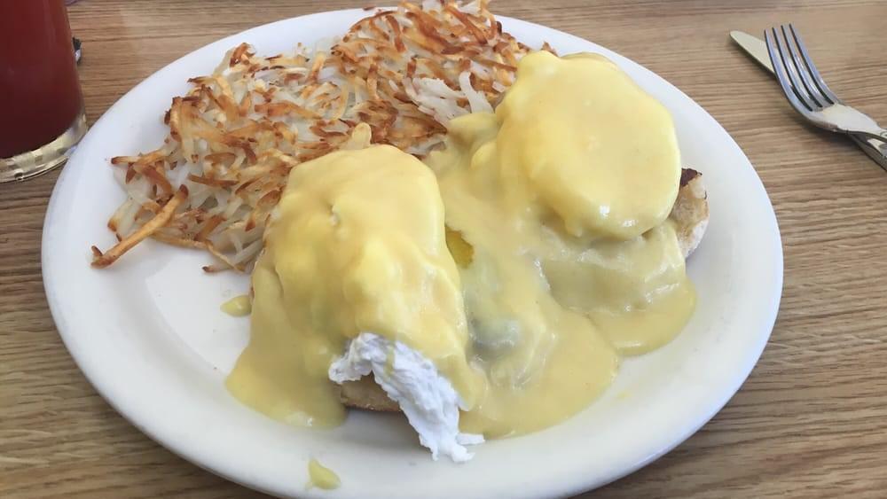 Crab Cakes Benedict · Grilled muffin topped with homemade crab cakes, poached eggs and hollandaise sauce.