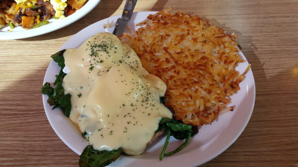 Eggs Florentine · Grilled muffin topped with spinach, poached eggs and hollandaise sauce.