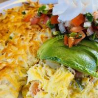 Fajita Omelet · Choice of beef or chicken with onions, bell peppers and cheese topped with salsa and sour cr...