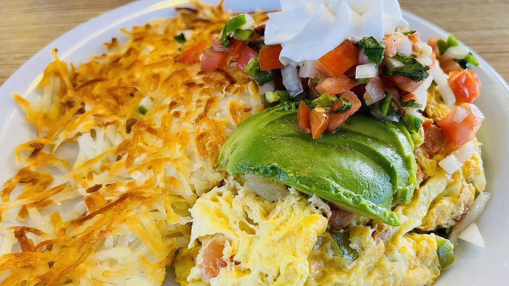 Fajita Omelet · Choice of beef or chicken with onions, bell peppers and cheese topped with salsa and sour cream.