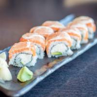 49er Roll · Cal roll top with salmon and lemon slices.